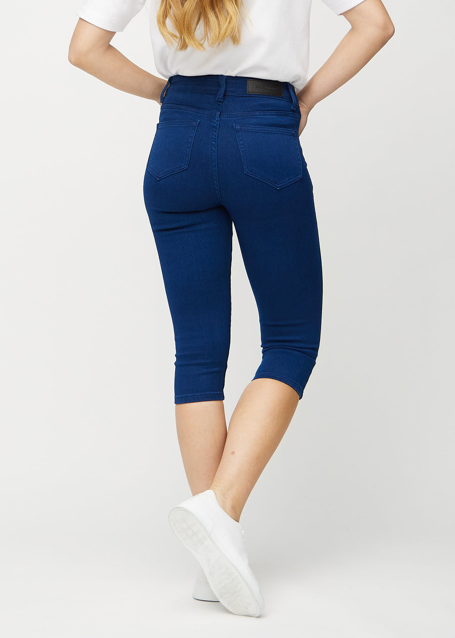 Dunkelblaue skinny Capris von hinten gesehen, sodass man das gesamte Produkt sehen kann.