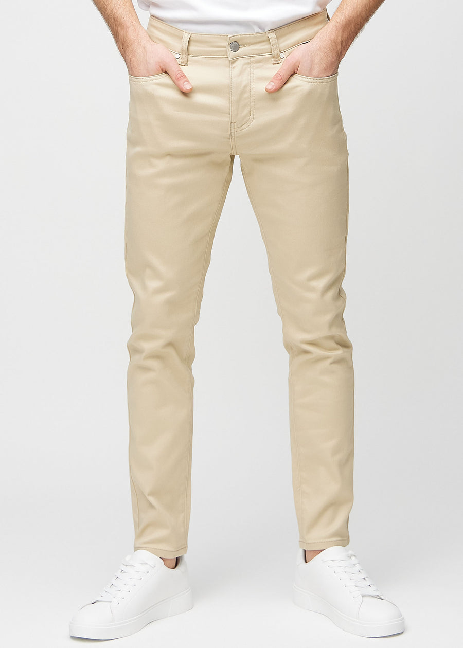Beige slim jeans, modelnavn Gazelles, som sidder tæt til benet, set forfra.